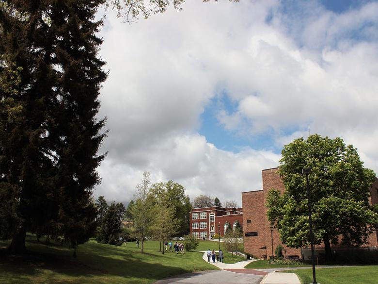 Students walk toward the General Studies Building